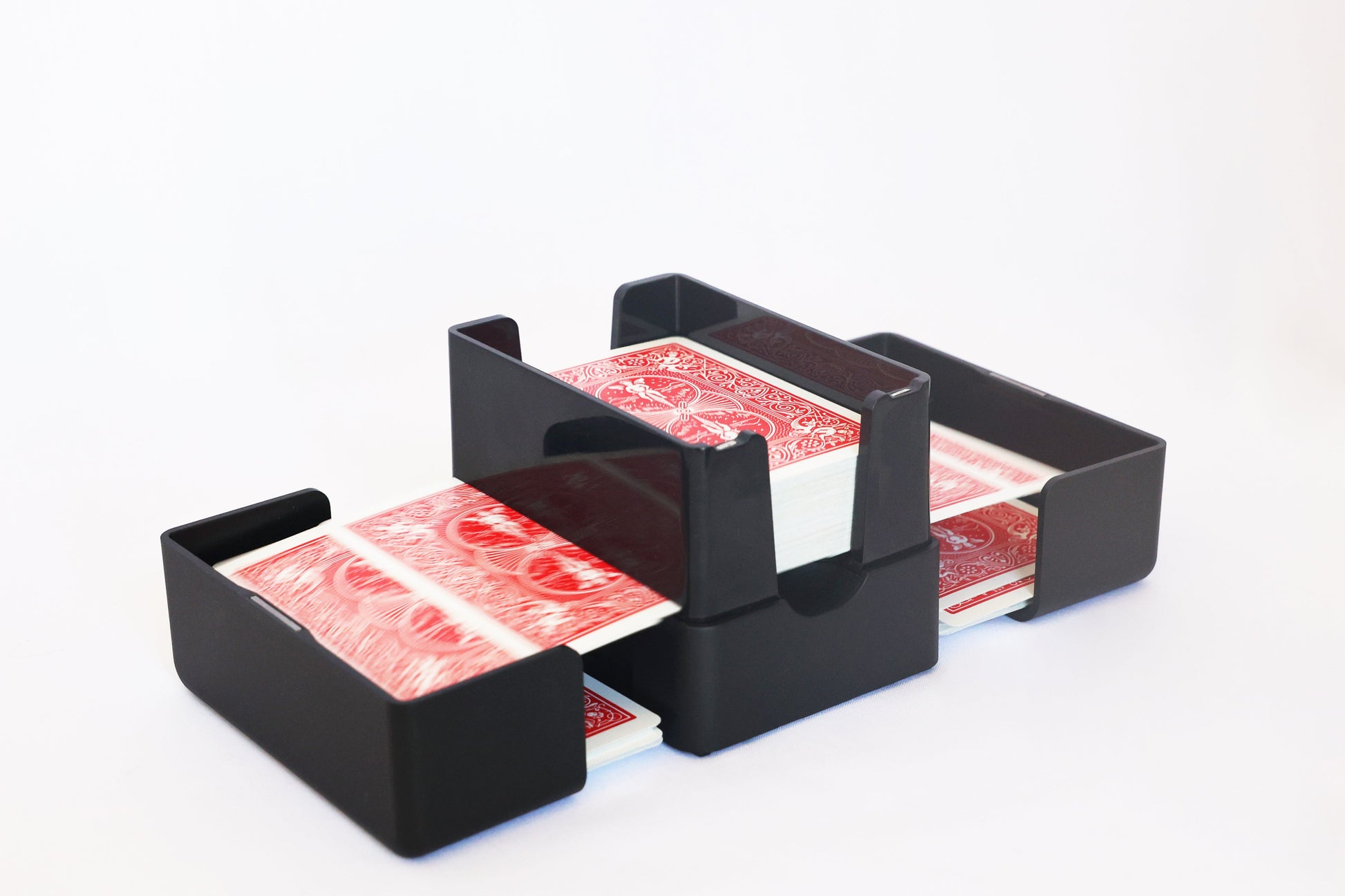 Close-up of a red deck interleaving as the Lotus shuffler riffles it