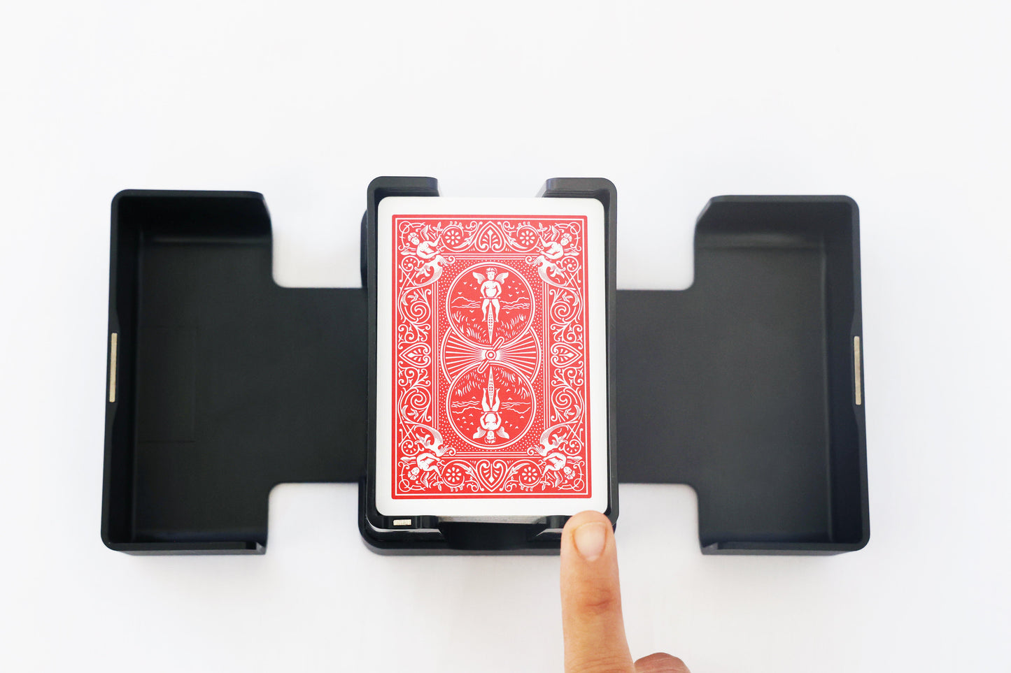 Overhead view of a fingertip pressing the Lotus shuffler touch sensor