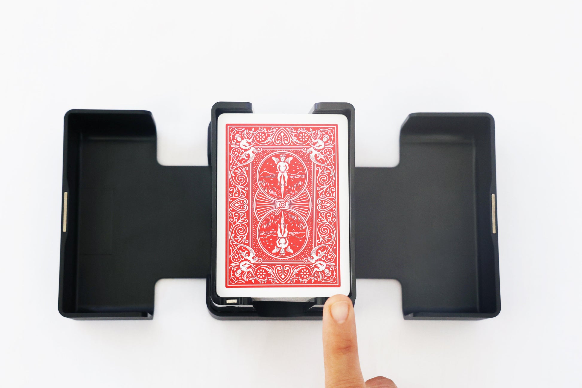Overhead view of a fingertip pressing the Lotus shuffler touch sensor
