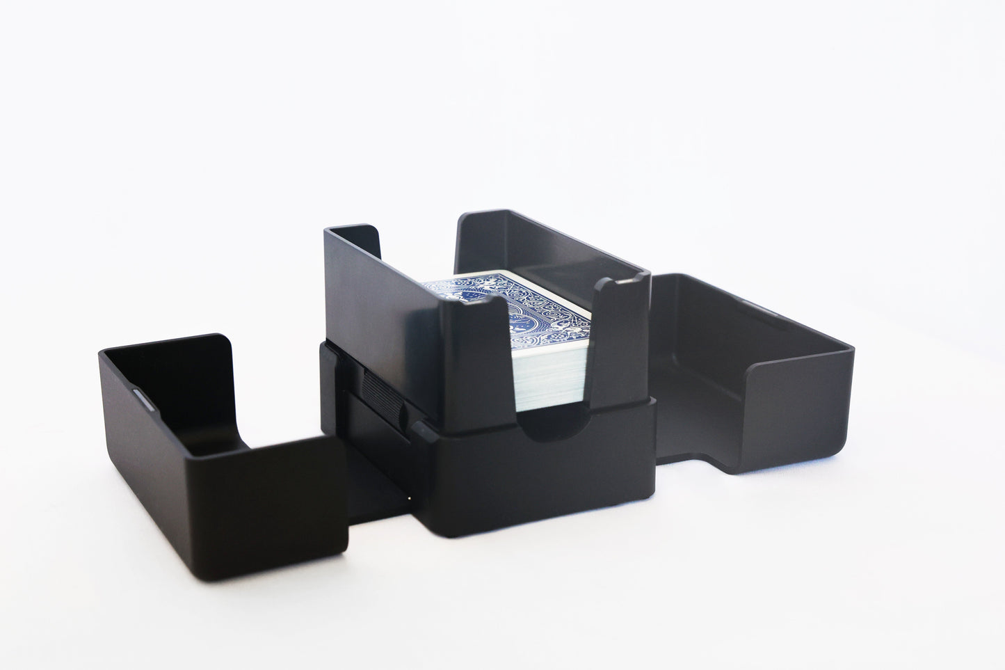 Lotus card shuffler open with a blue deck loaded in the center